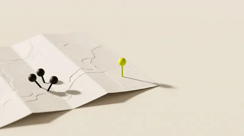 Folded paper map in relief with three black pins grouped together and one lime pin set apart.